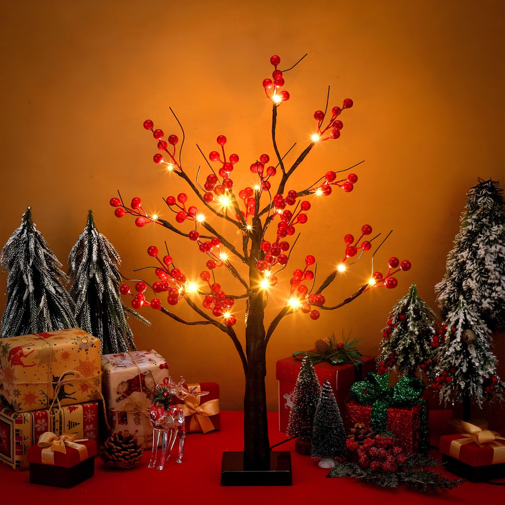 Árbol de mesa iluminado en una composición navideña