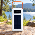 Power bank solar 637CX blanco con asa naranja y panel frontal